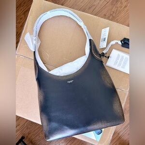 Coach Smooth Black Leather Hobo Shoulder Bag with “Loved Leather” finish.